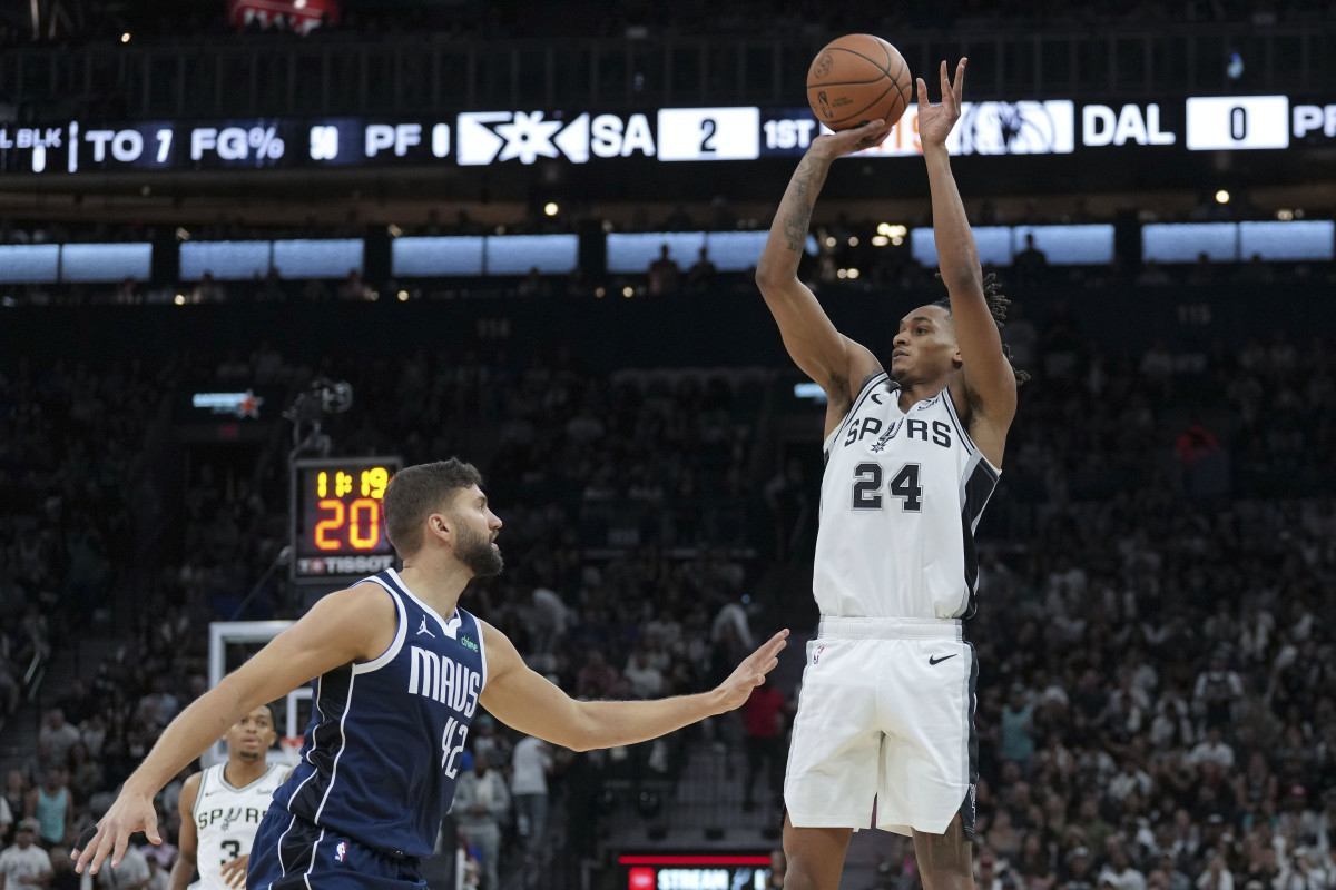 Oct 25, 2023; San Antonio, Texas, USA; San Antonio Spurs guard Devin Vassell (24) shoots over Dallas Mavericks forward Maxi Kleber (42) in the first half at the Frost Bank Center.